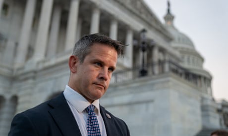 man in suit stands outside us capitol